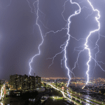 City with lights turned on during night time. Image source: Leo Caldas/Pexels/Canva