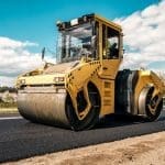 Road roller laying asphalt. Image source: Vova Shevchuk/Canva