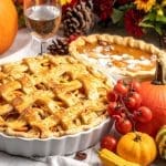 A traditional Thanksgiving spread feels incomplete without a pumpkin pie. Image Source: TrueCreatives/Canva