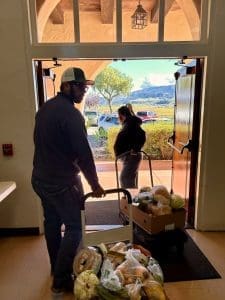 Hundreds Rely On People Helping People’s Thanksgiving Food Distribution : It Takes a Team to Feed 191 Households