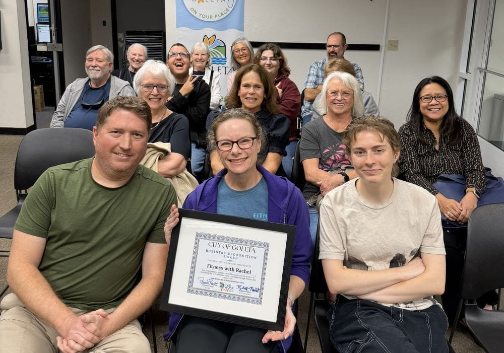 Rachel in Council Chambers with her family, friends and clients