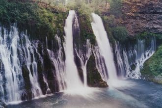 Representative picture of Burney Falls at the McArthur-Burney Falls Memorial State Park. Image Source: melissa.mn Images/Canva