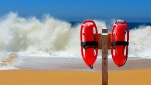 Dramatic Video Shows Lifeguard Rescuing Beachgoers From Powerful Shorebreak